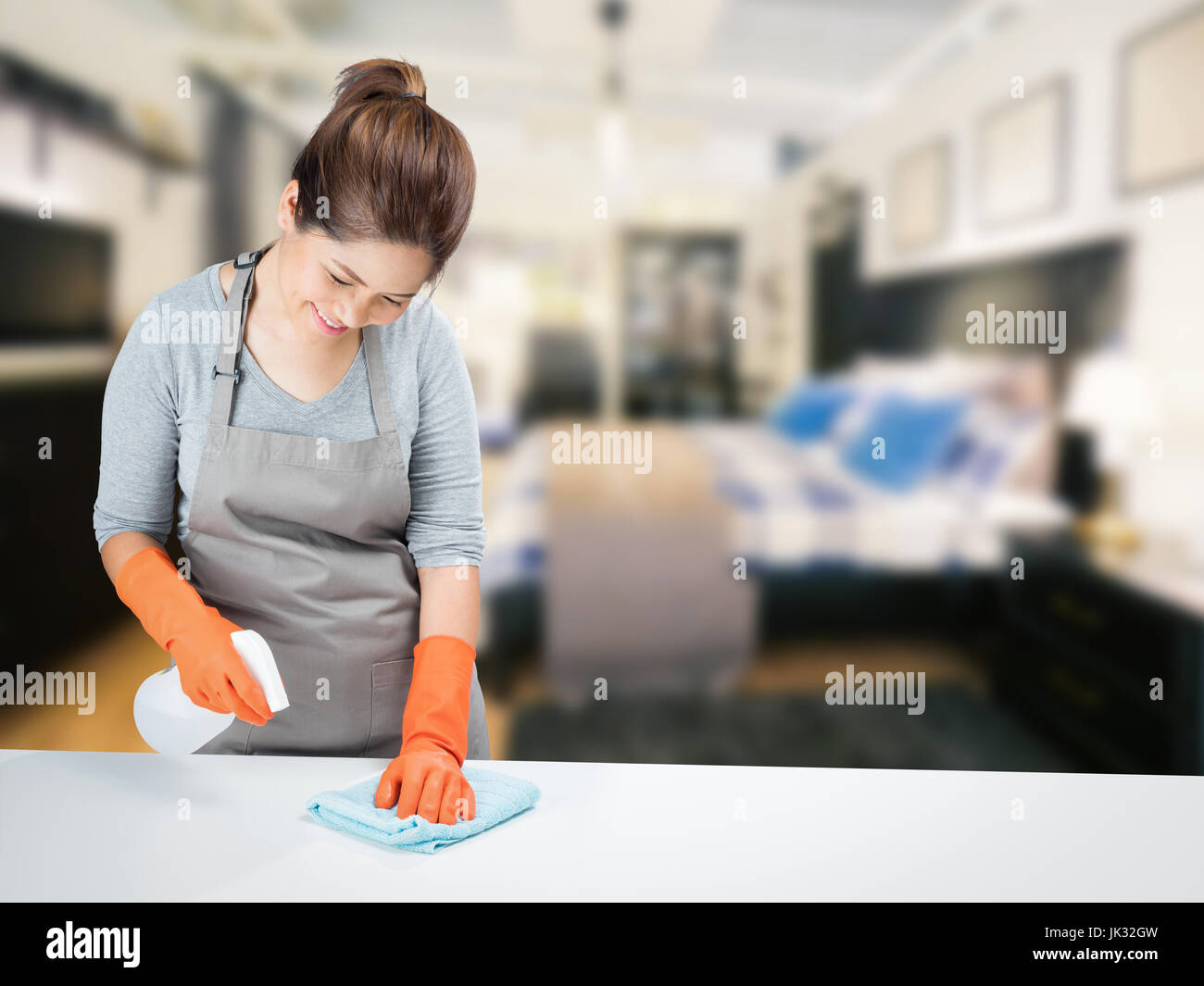 asian housewife sweeping on table Stock Photo Alamy