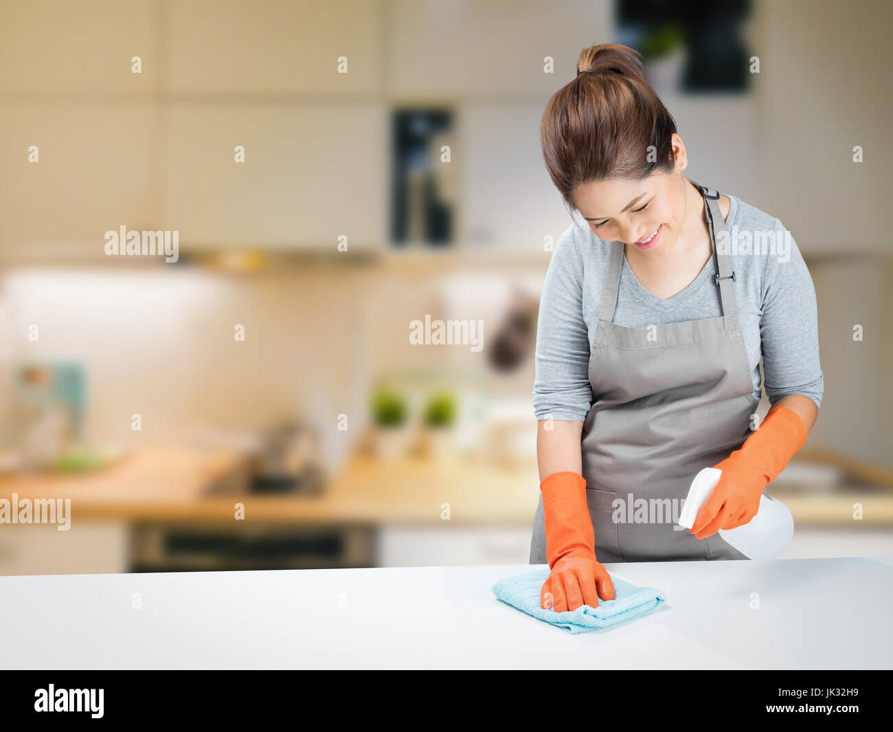 asian housewife sweeping on table Stock Photo Alamy