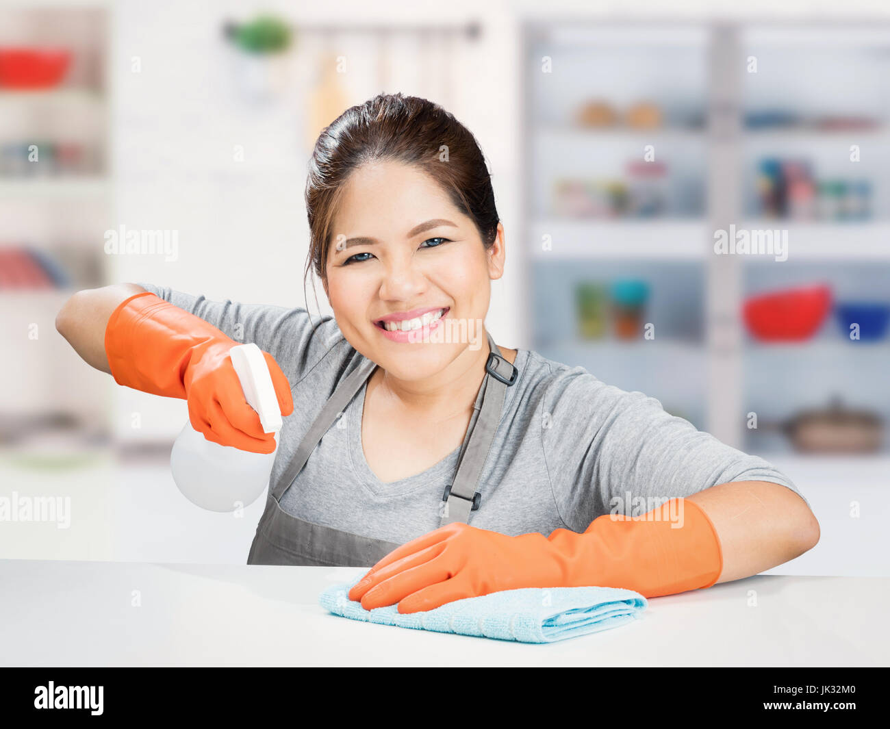 asian housewife sweeping on table Stock Photo Alamy