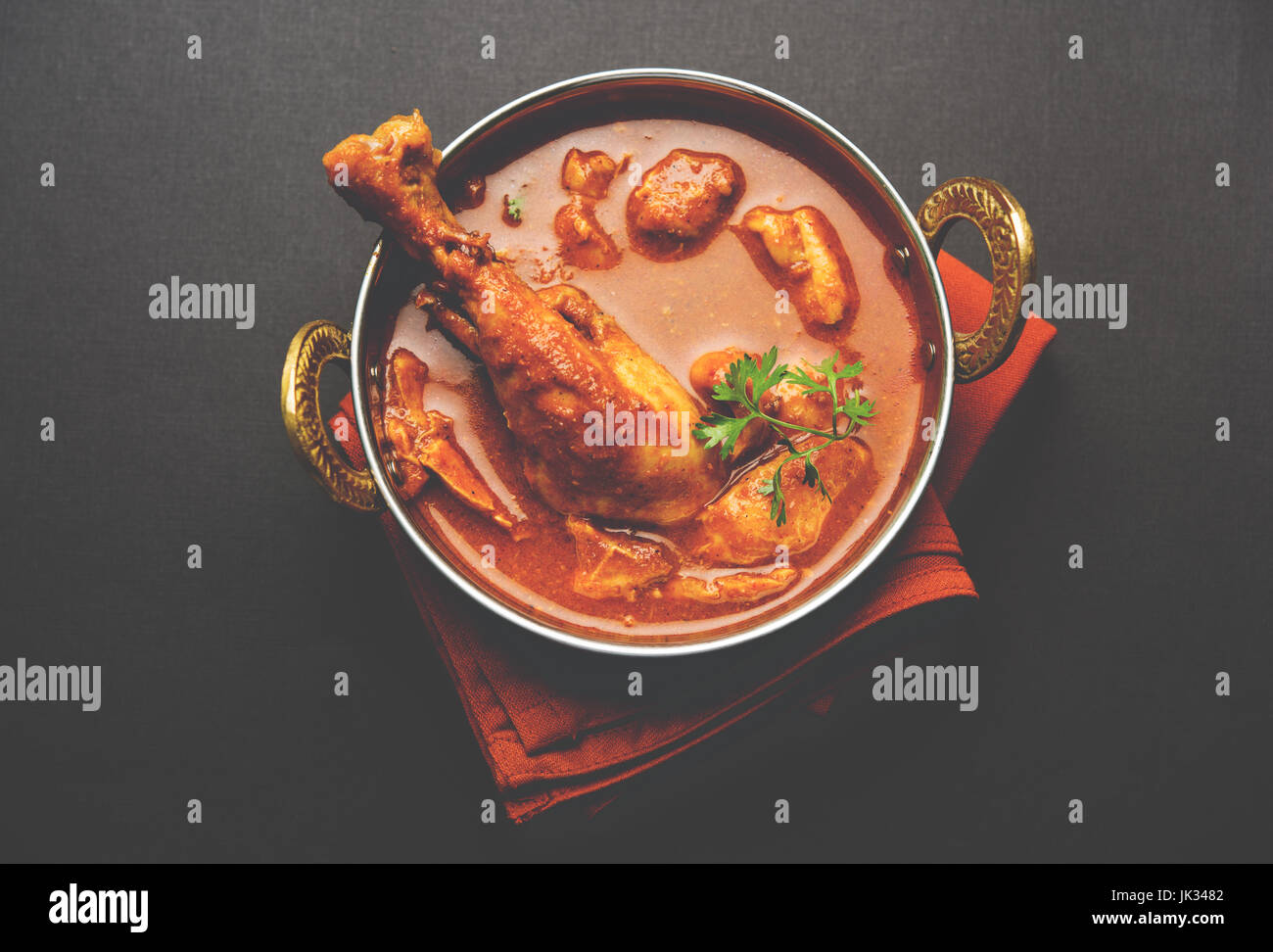 Indian spicy Chicken curry or masala chicken with prominent leg piece