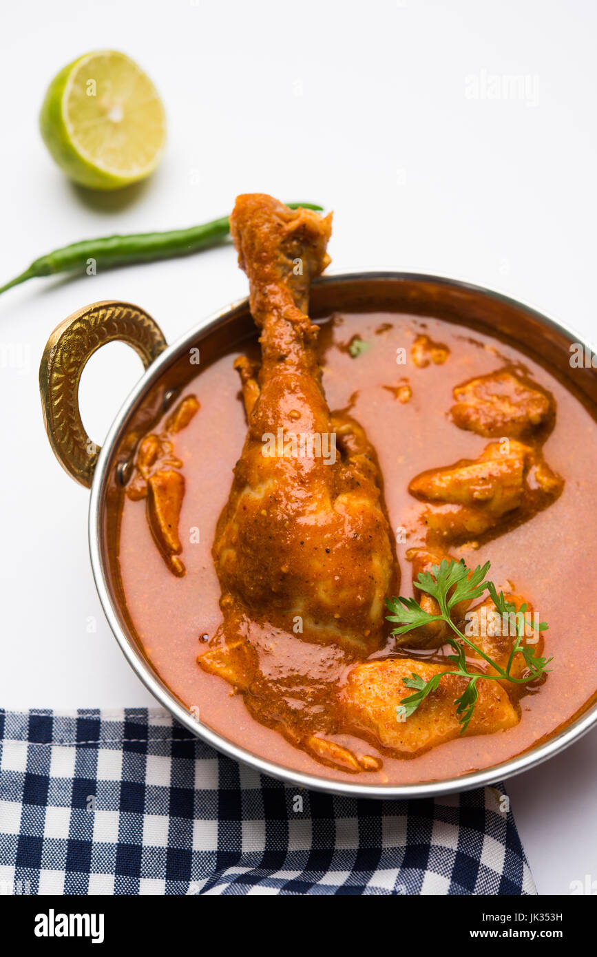 Indian spicy Chicken curry or masala chicken with prominent leg piece, popular recipe from India