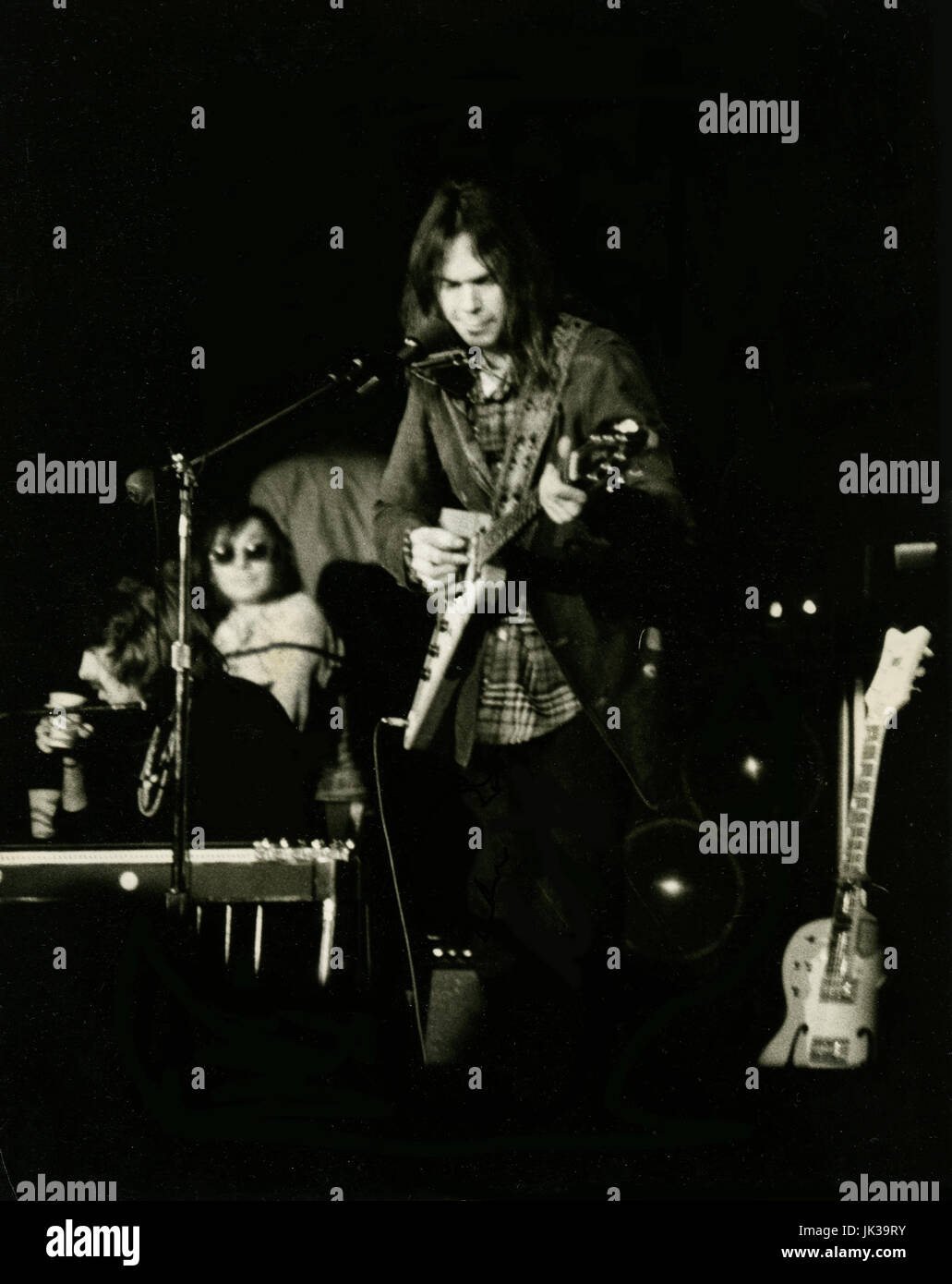 Neil Young in concert in San Francisco circa 1970s at Fillmore West. Stock Photo