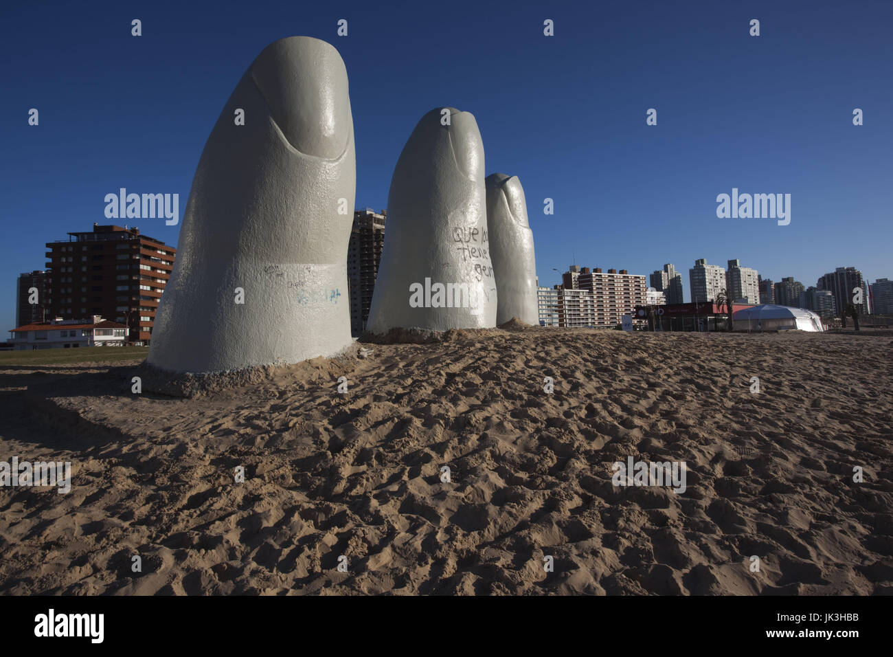 Uruguay, Punta del Este, Playa Brava beach, La Mano en la Arena, Hand in the Sand, sculpture. by Chilean Artist Mario Irarrazabal Stock Photo