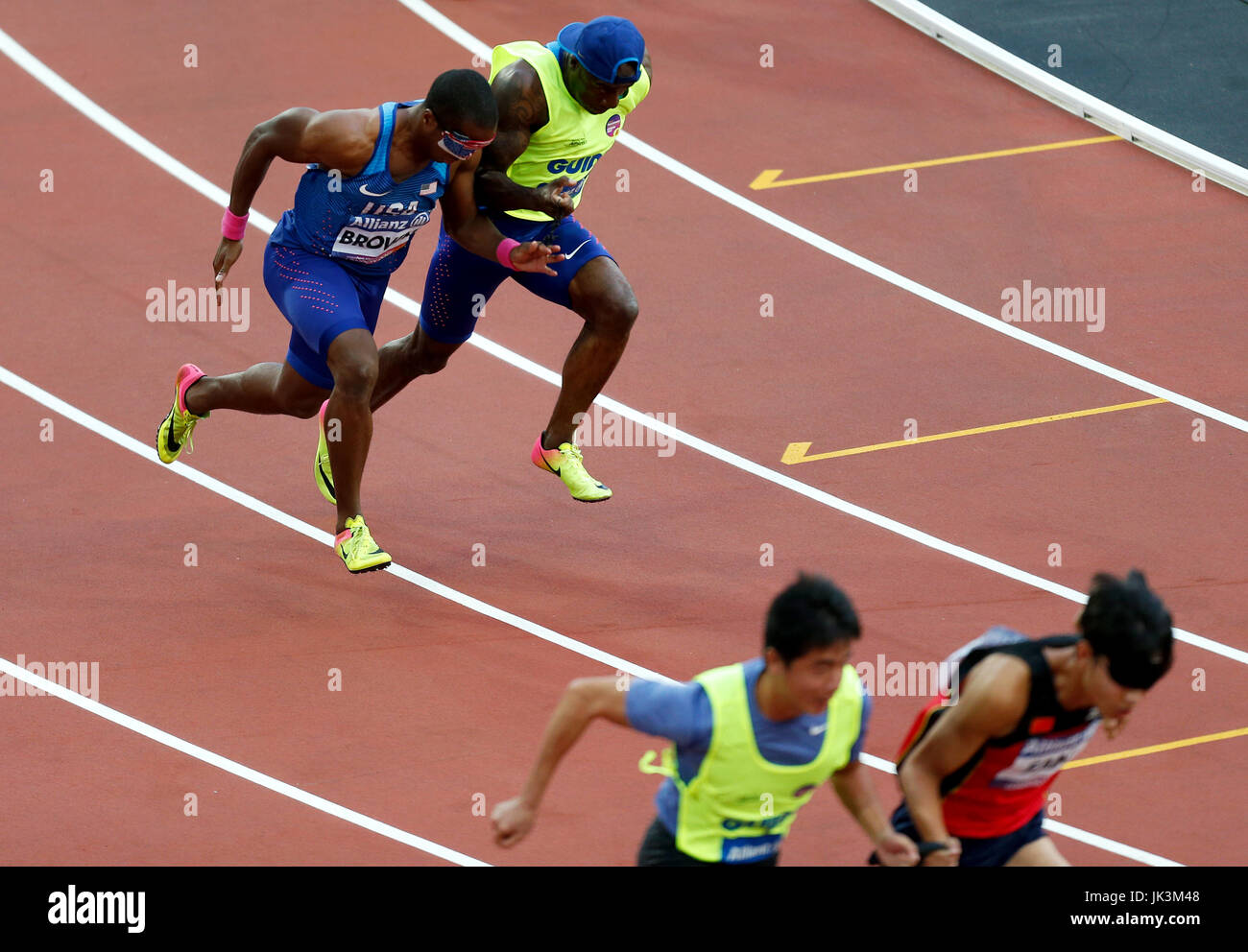 USA's David Brown and guide Jerome Avery in action in the Men's 200m T11 Final during day eight of the 2017 World Para Athletics Championships at London Stadium. Stock Photo