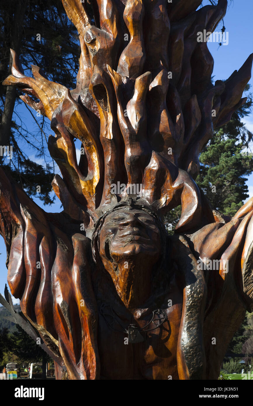 Argentina, Rio Negro Province, Lake District, El Bolson, Plaza Pagano, native themed tree of life sculpture Stock Photo