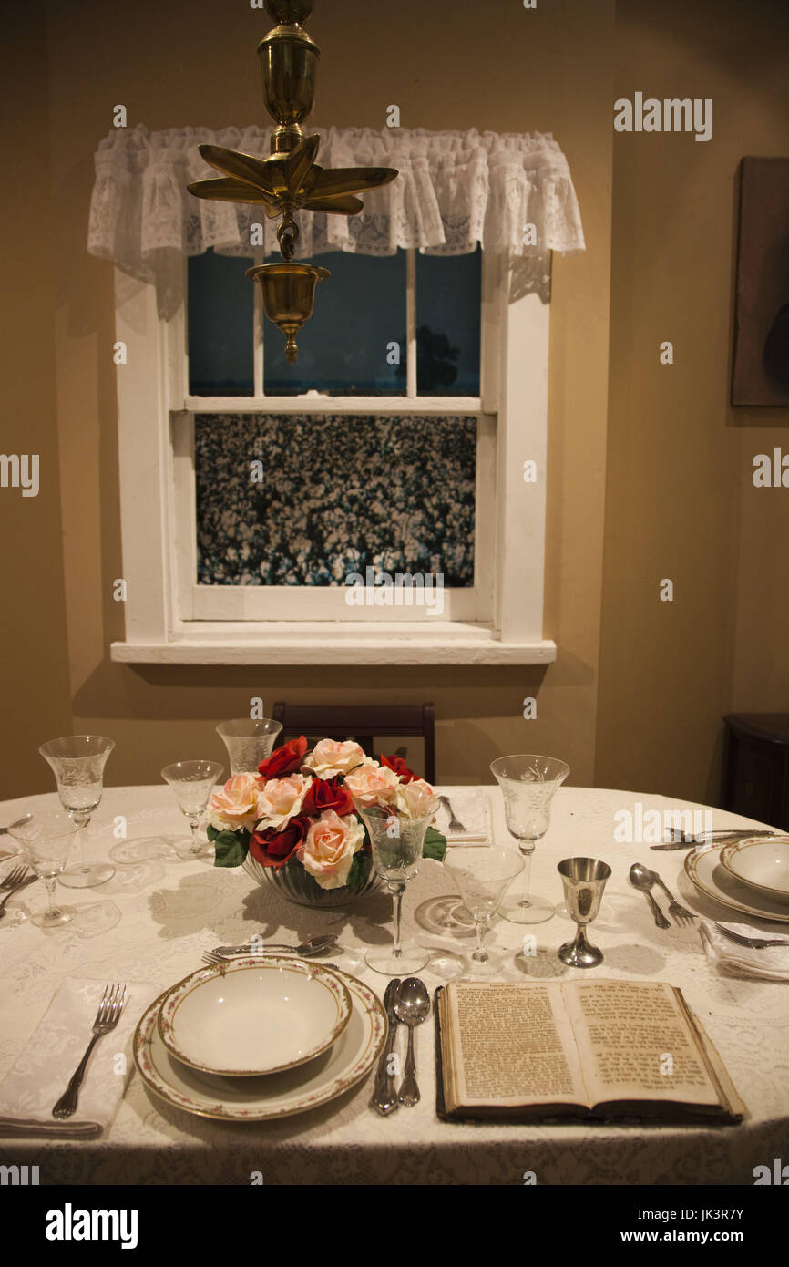 USA, Mississippi, Utica, Henry Jacobs Camp, Museum of the Southern Jewish Experience, seder table display with cotton filed outside window Stock Photo