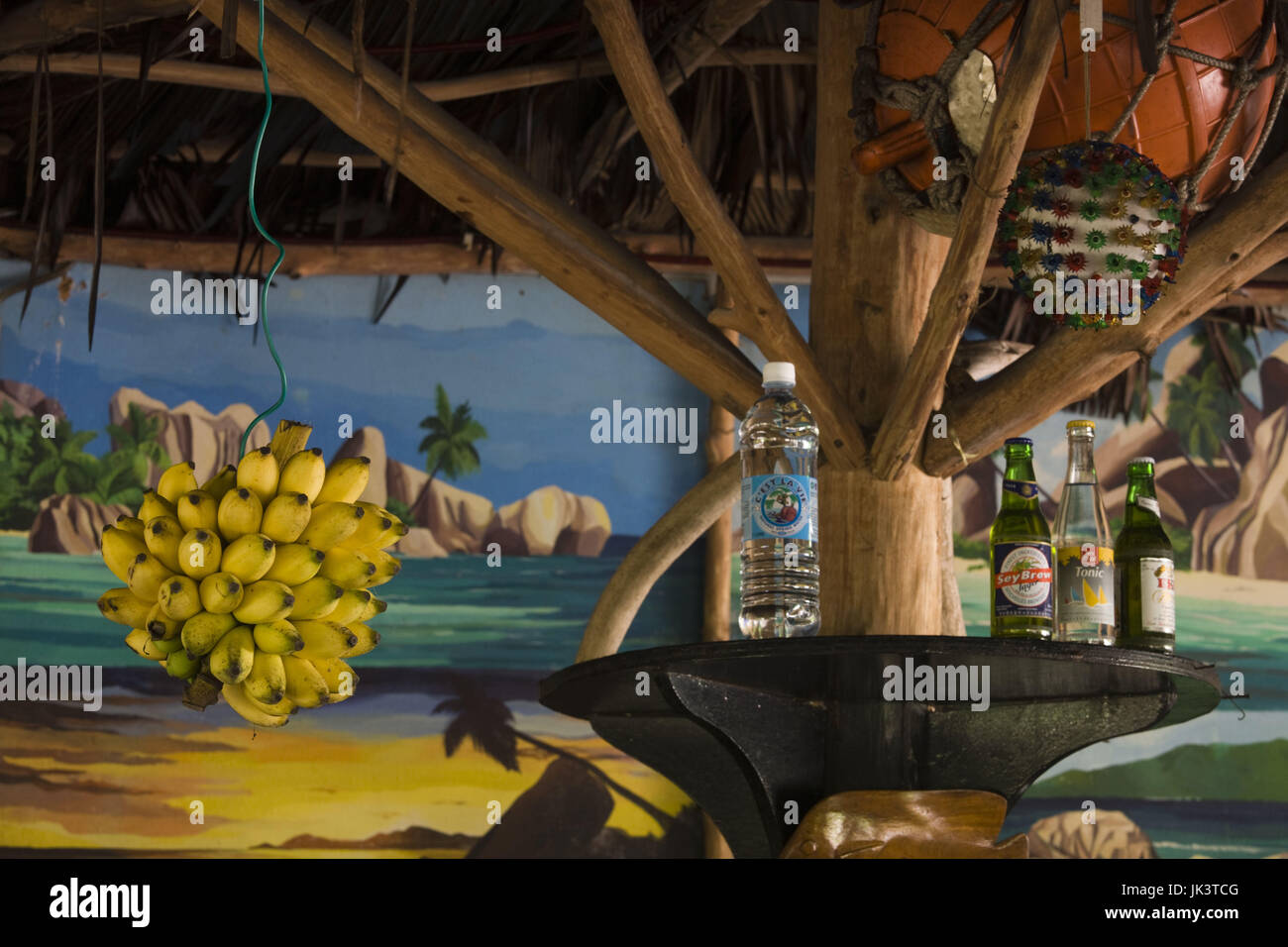 Seychelles, La Digue Island, Grand Anse, hanging bananas at Loutier Coco beach cafe Stock Photo