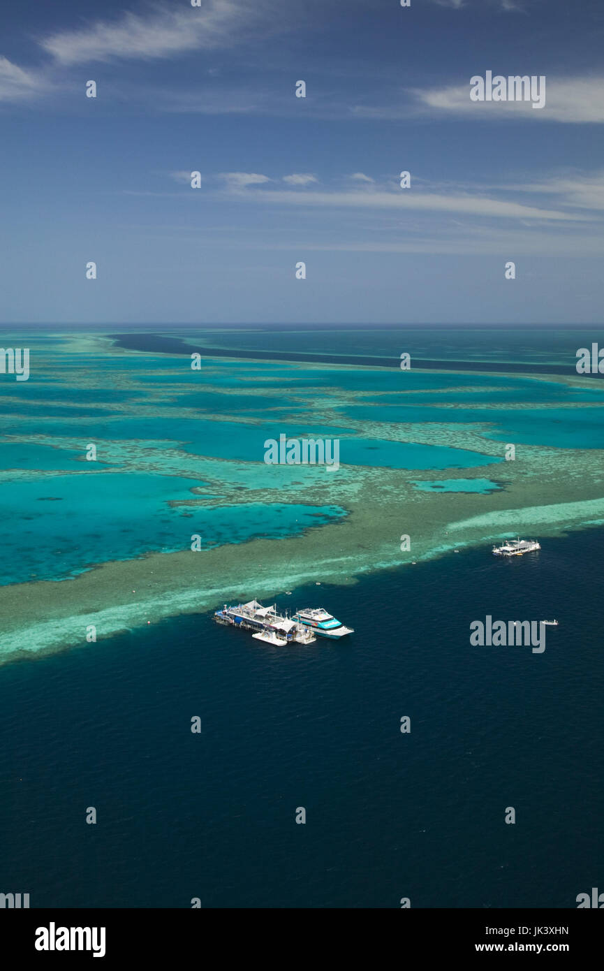 Australia, Queensland, Whitsunday Coast, Great Barrier Reef, Aerial of the Great Barrier Reef by the Whitsunday Coast with Diving Boats anchored in its river, Stock Photo