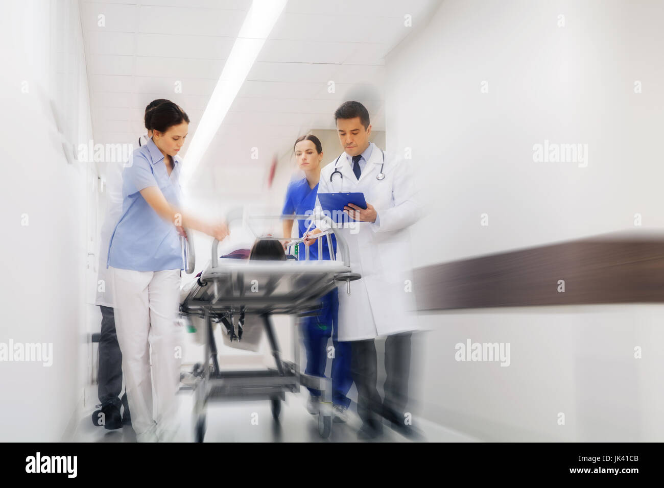 medics and patient on hospital gurney at emergency Stock Photo Alamy