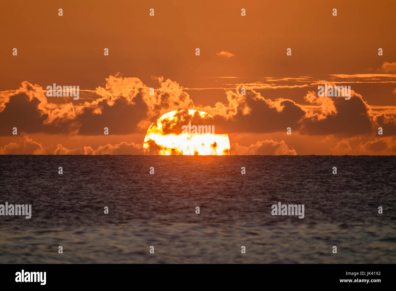 Sunset on horizon of ocean Stock Photo