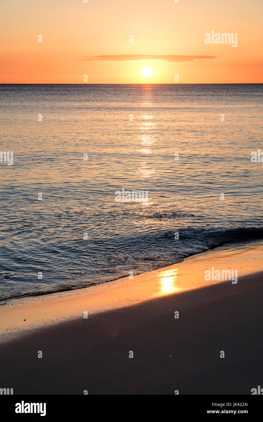 Sunset on ocean beach Stock Photo