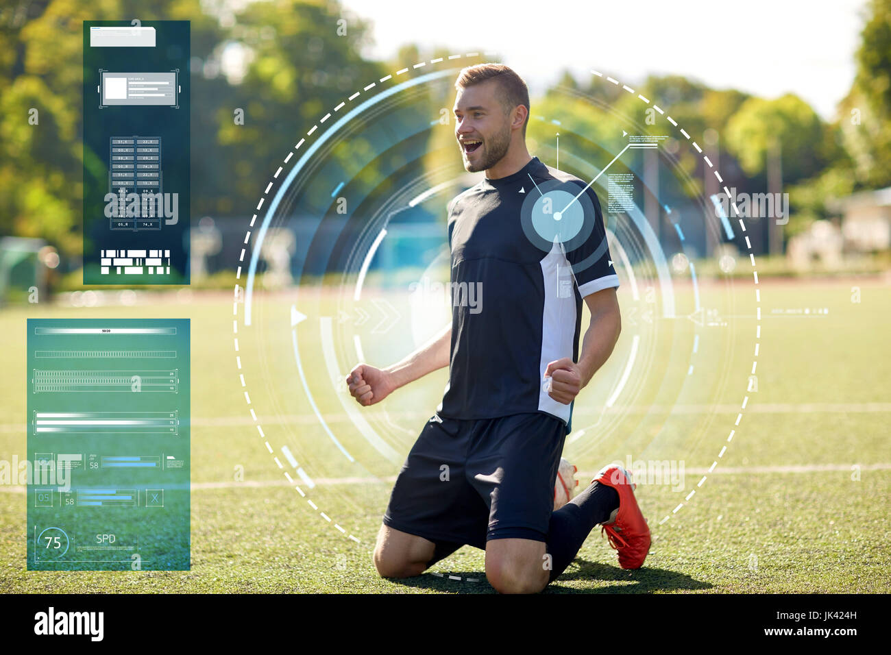 happy soccer player with ball on football field Stock Photo
