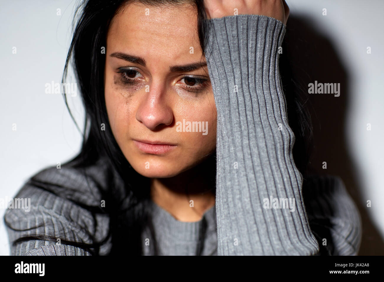 close up of unhappy crying woman Stock Photo