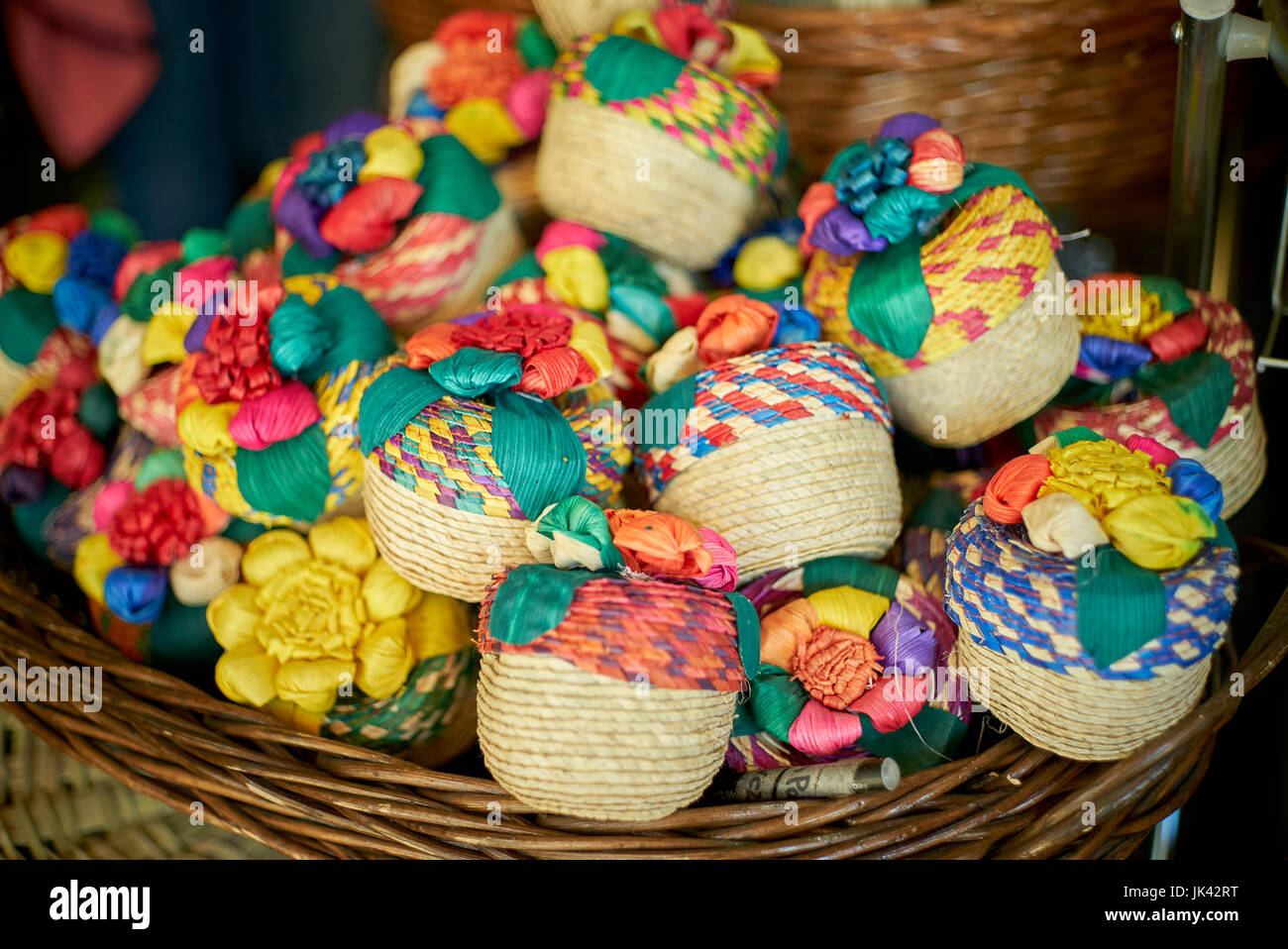 Multicolor trinkets in basket Stock Photo