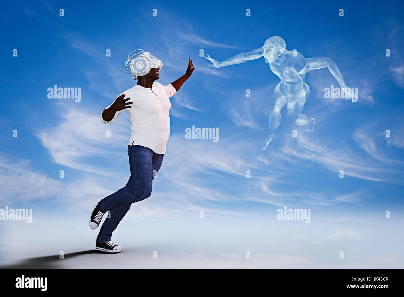 Man wearing virtual reality helmet reaching for fling spirit Stock Photo