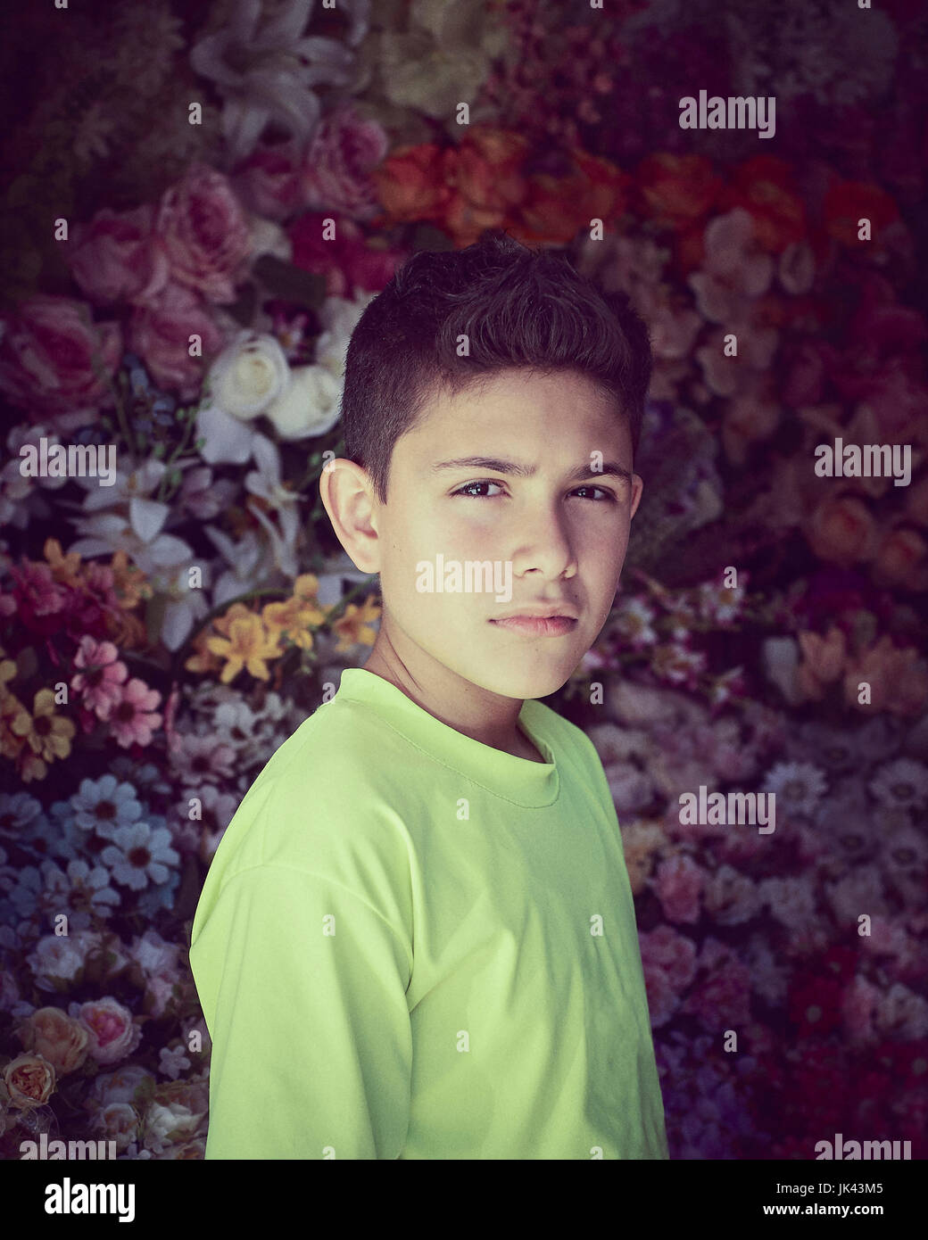 Portrait of serious Hispanic boy Stock Photo