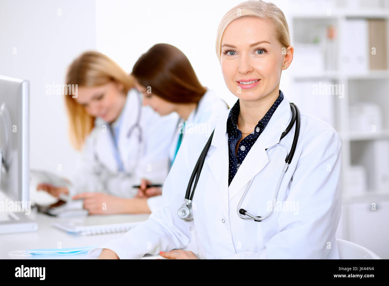Female doctor leading a medical team at the hospital Stock Photo - Alamy