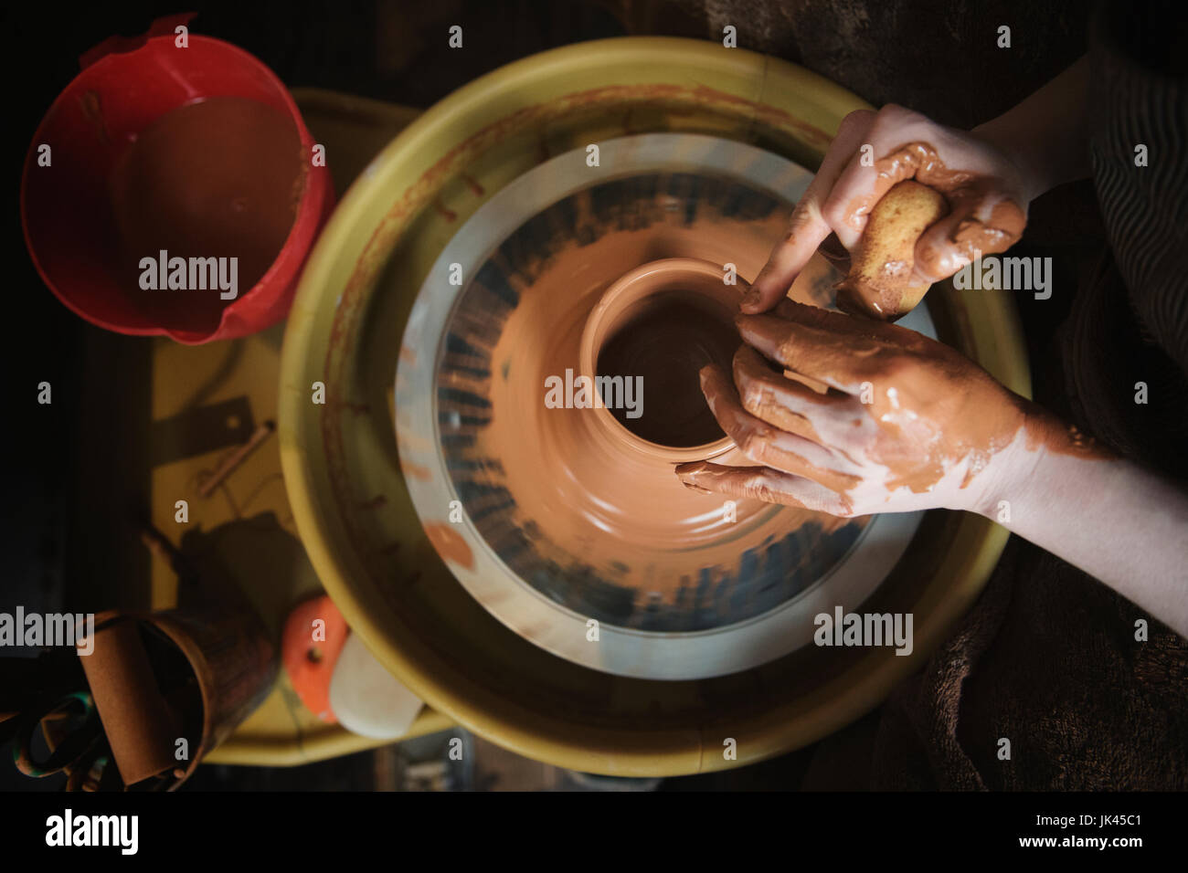 Hands of Caucasian woman shaping pottery clay on wheel Stock Photo Alamy