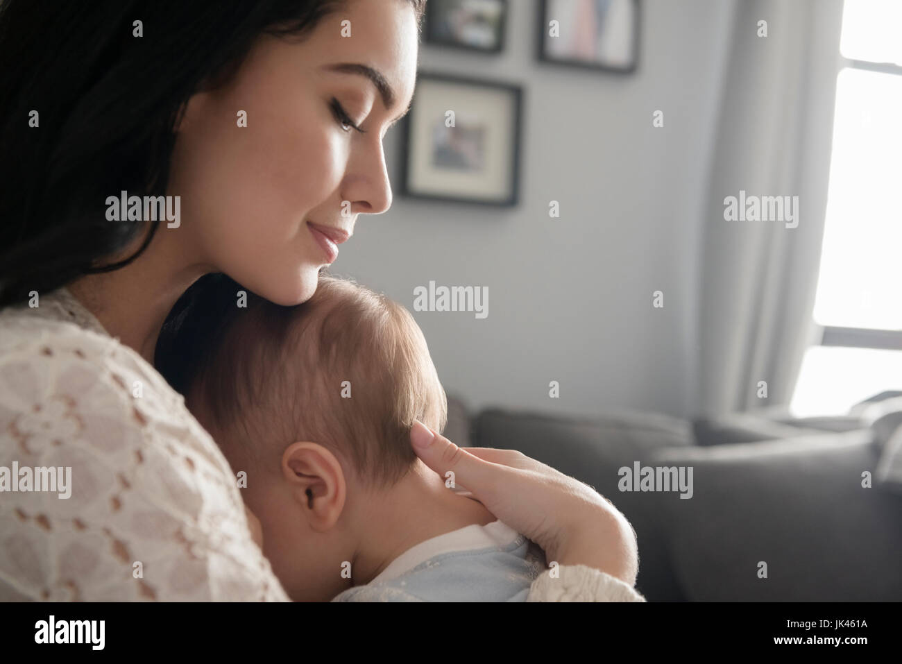 Caucasian mother comforting baby son Stock Photo