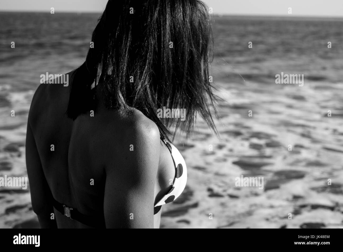 Close up of Caucasian woman wearing bikini on beach Stock Photo