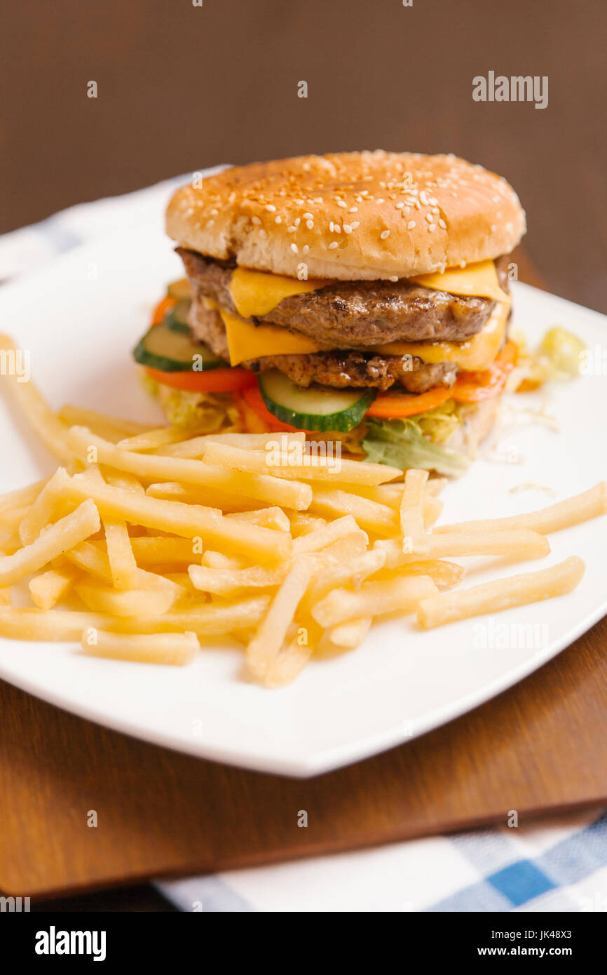 Cheeseburger and french fries Stock Photo