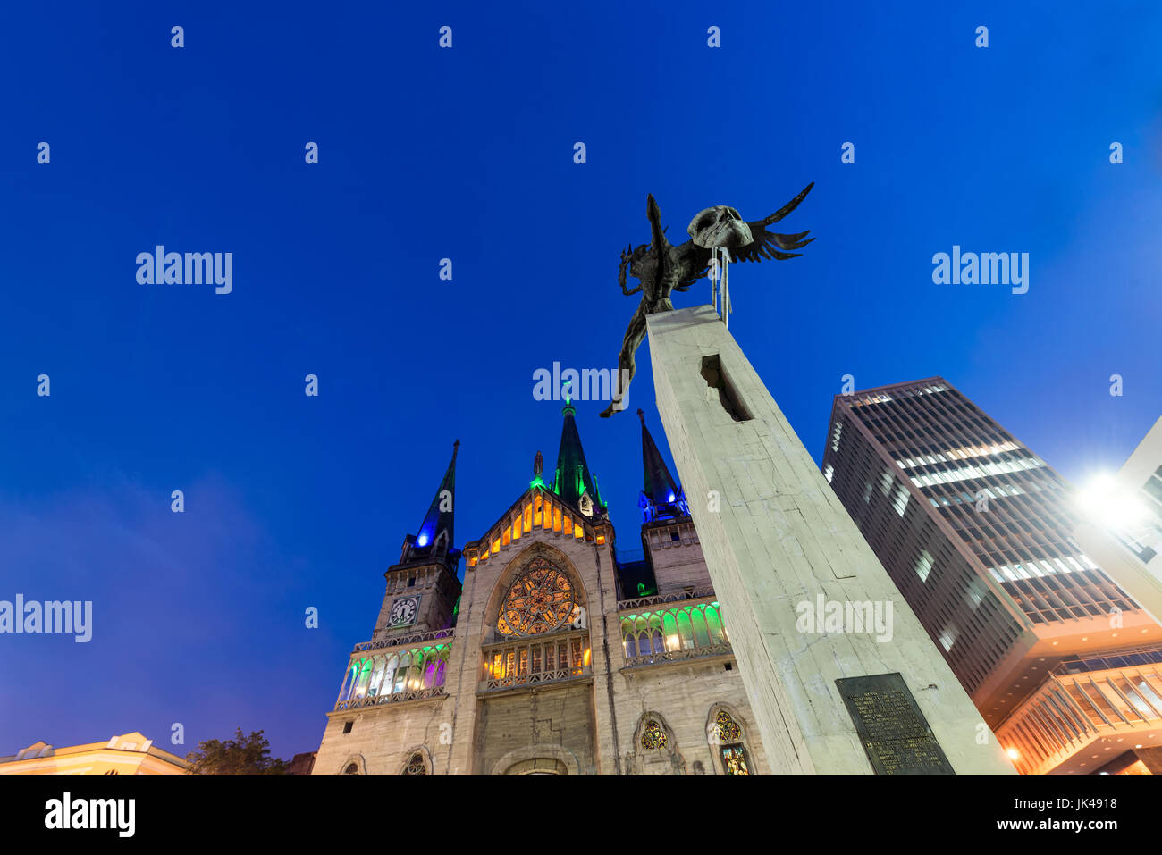 Looking up at the Bolivar Condor statue and cathedral in the Plaza de Bolivar in Manizales, Colombia Stock Photo