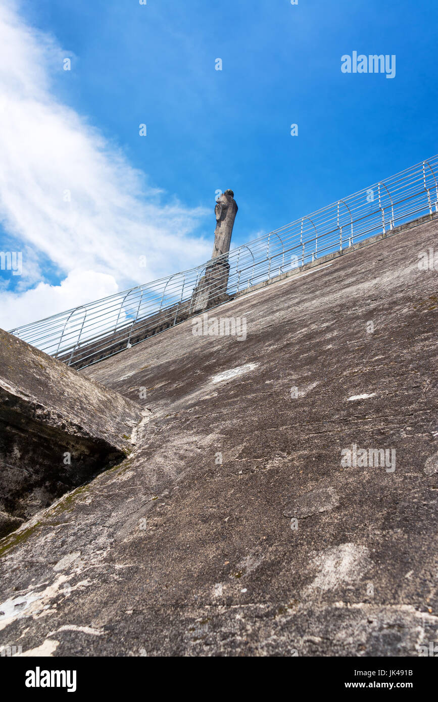 Looking up at a religious statue on the roof of the cathedral in Manizales, Colombia with a nice blue sky Stock Photo