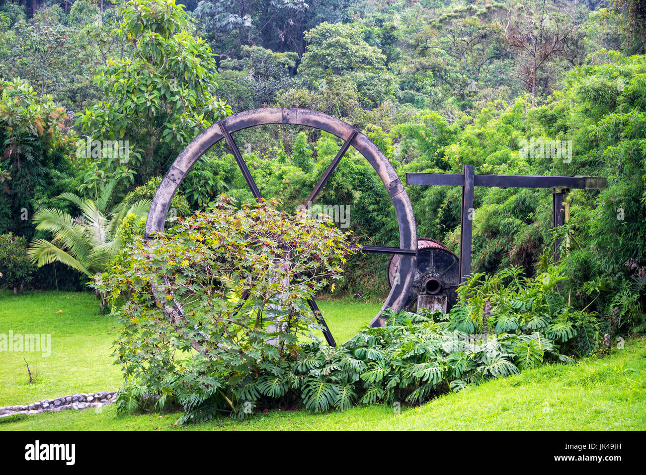 Lush green foliage and old watermill near Manizales, Colombia Stock Photo