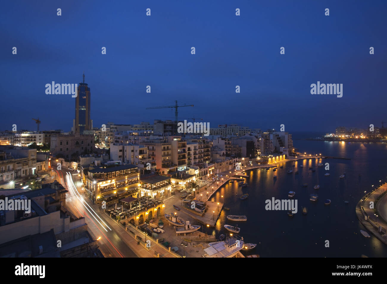 Malta, Valletta, St. Julian's, Spinola Bay and Portomaso Tower, high angle view, evening Stock Photo