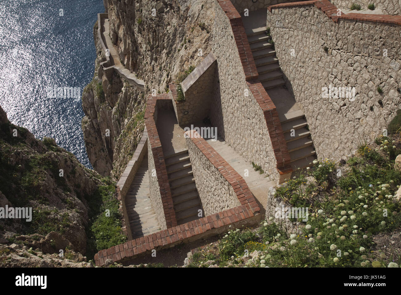Italy, Sardinia, Western Sardinia, Alghero, Capo Caccia cape,  Escala del Cabirol stairs to the Grotta de Nettuno caves Stock Photo