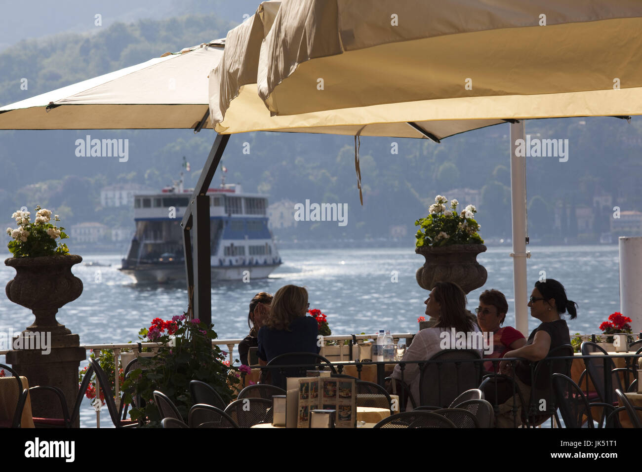 Italy, Lombardy, Lakes Region, Lake Como, Bellagio, lakeside cafe, dusk ...