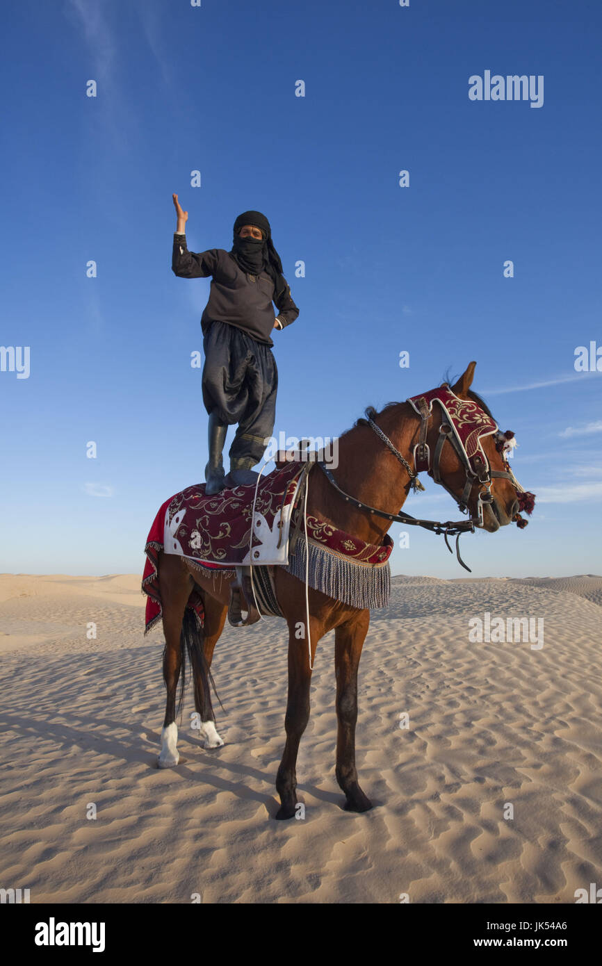 Tunisia, Sahara Desert, Douz, Great Dune, rider and horse, NR Stock Photo