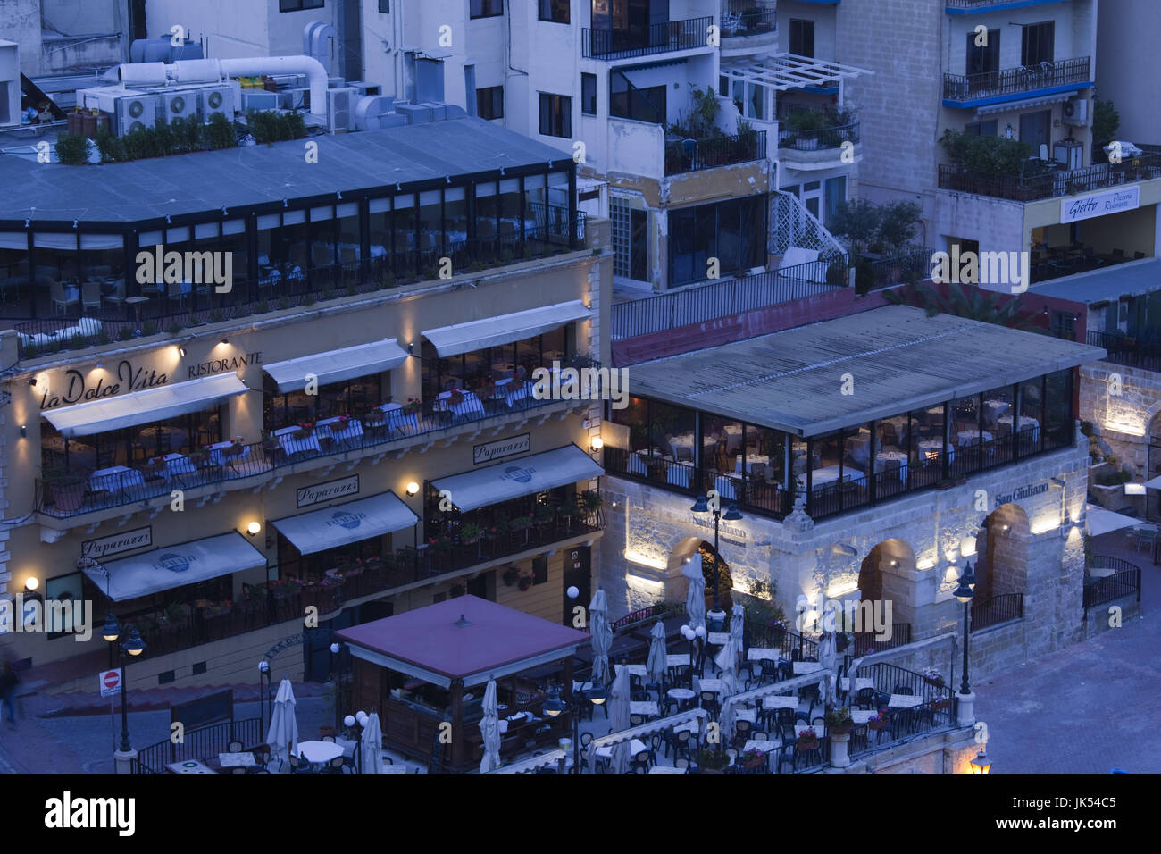 Malta, Valletta, St. Julian's, cafes on Spinola Bay, high angle view, evening Stock Photo
