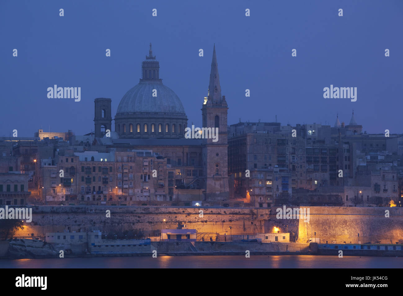 Malta, Valletta, city view with St. Paul's Anglican Cathedral and Carmelite Church from Sliema, dusk Stock Photo