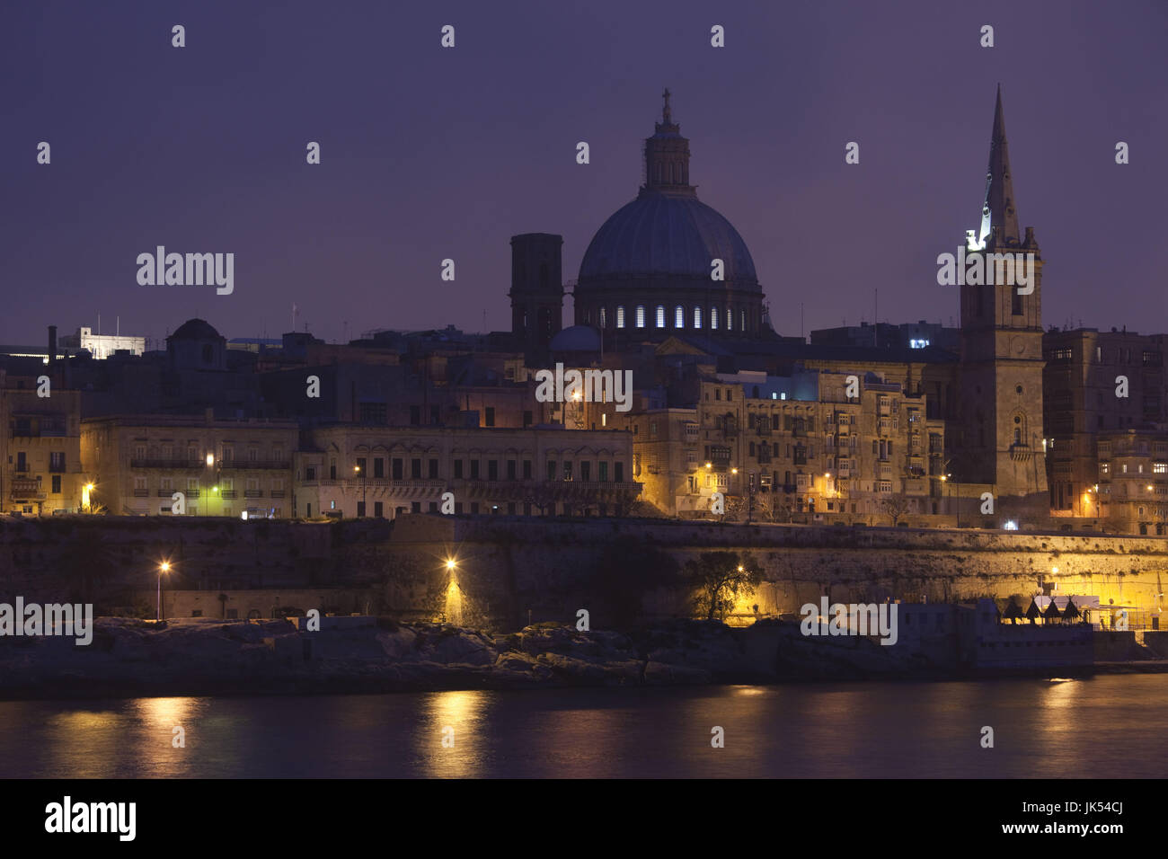 Malta, Valletta, city view with St. Paul's Anglican Cathedral and Carmelite Church from Sliema, dusk Stock Photo