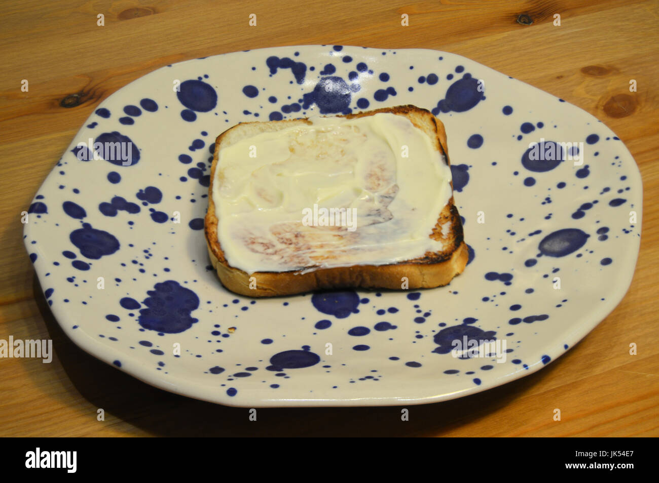 BLT Preparation Step 3 of 7 : spread mayonnaise on each toasted bread Stock Photo