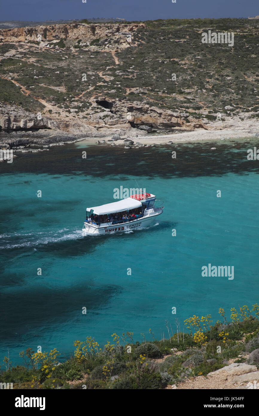 Malta, Comino Island, The Blue Lagoon with tour boat Stock Photo
