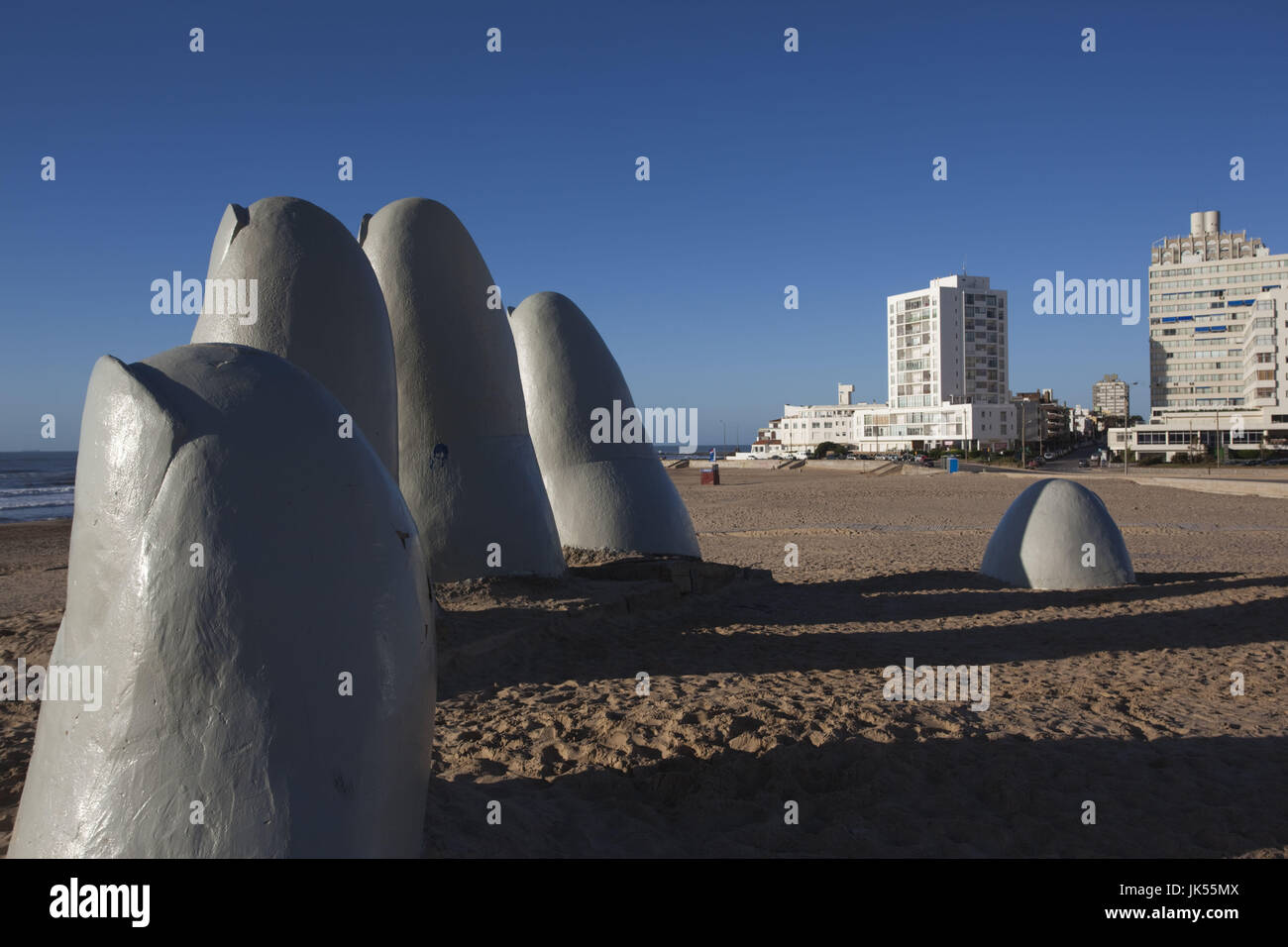 Uruguay, Punta del Este, Playa Brava beach, La Mano en la Arena, Hand in the Sand, sculpture. by Chilean Artist Mario Irarrazabal Stock Photo