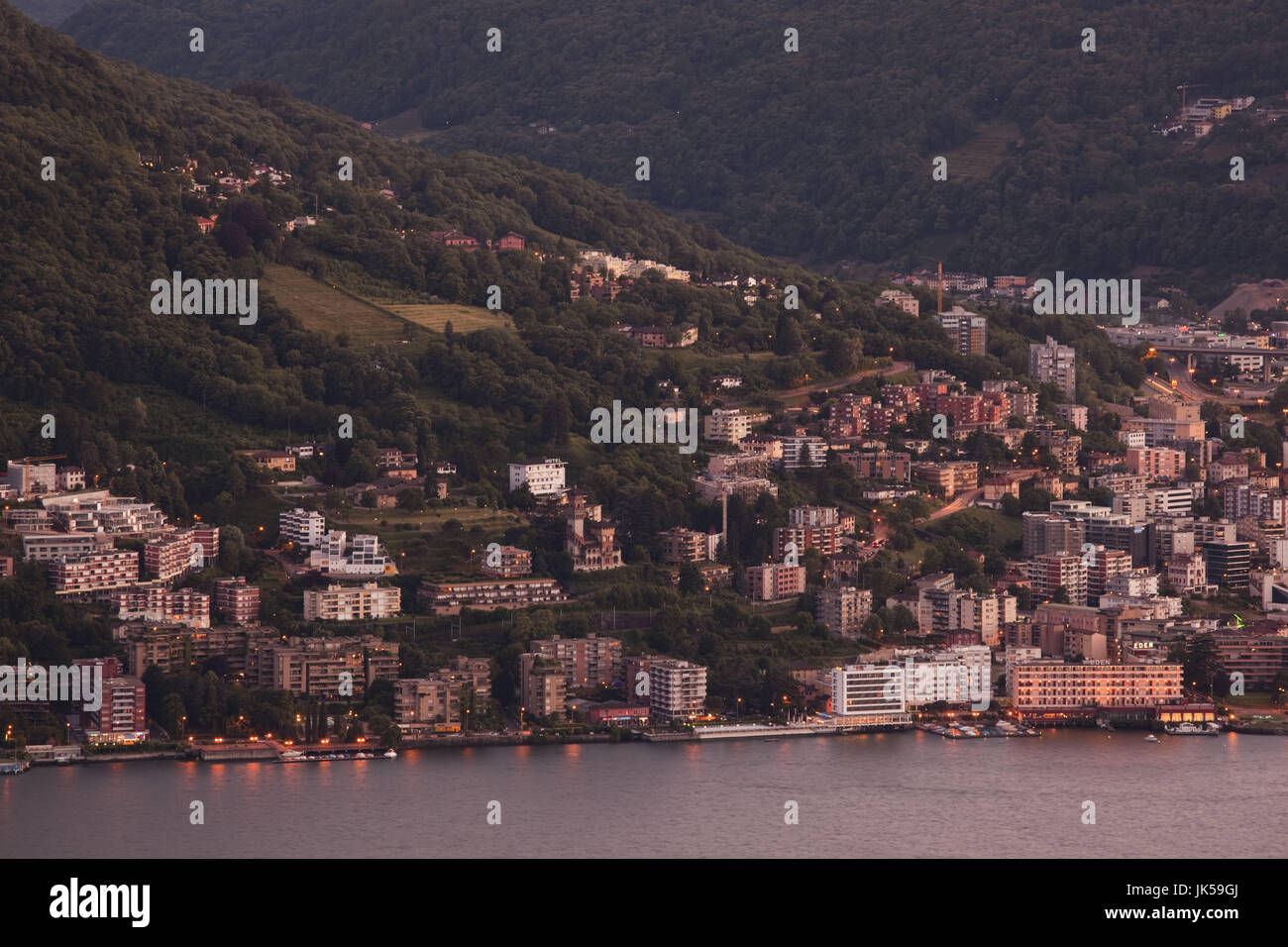 Switzerland, Ticino, Lake Lugano, Lugano, Paradiso area from Monte Bre, sunset Stock Photo