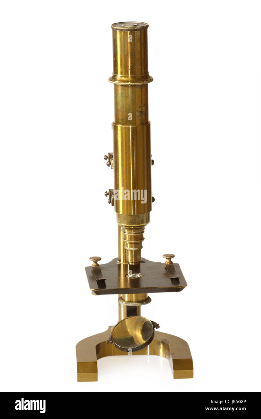 Old fashioned microscope from the 19th century. Isolated on white background. Stock Photo