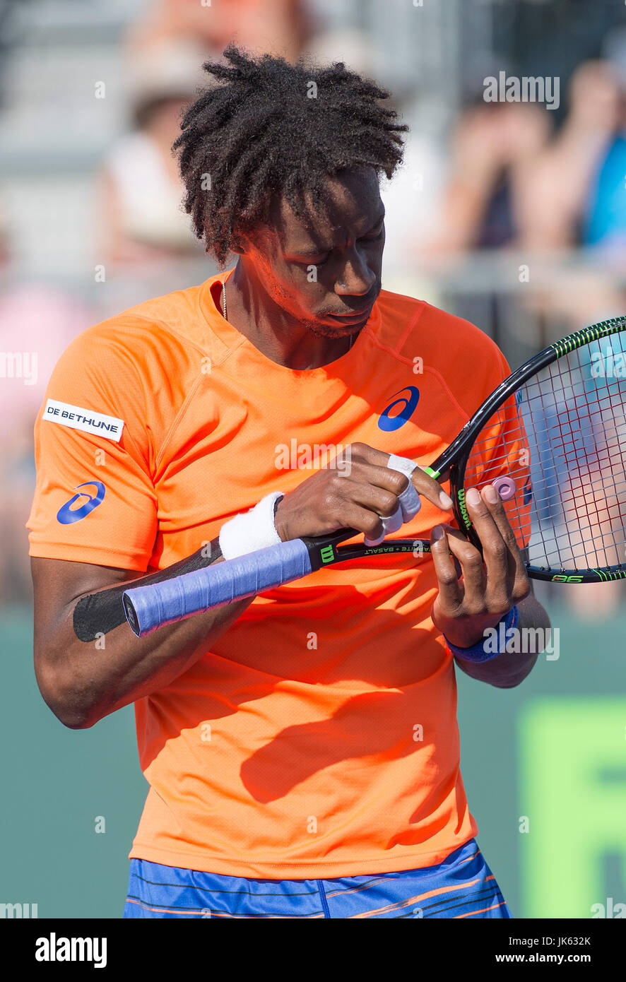 KEY BISCAYNE, FL - March 29: Gael Monfils (FRA) inspects his racket ...