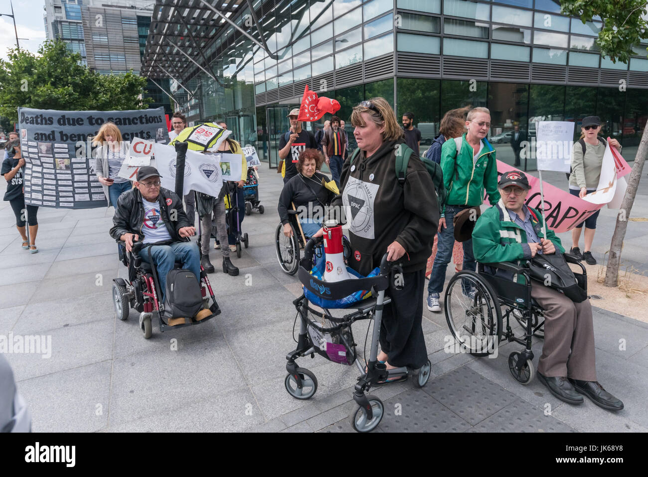 July 21, 2017 - London, UK - London, UK. 21st July 2017. Paula Peters gathers the protesters by the Euston Road crossing after their protest outside Atos over their false and inaccurate PIP assessments which are resulting in the deaths of disabled people who lose benefits. DPAC then ended their week of action during the London Para Athletics World Championships by blocking one carriageway of the Euston Road at Warren St for around ten minutes. The two police officers present asked them to move and then radioed for reinforcements, who arrived just after the protesters left the road. DPAC say th Stock Photo