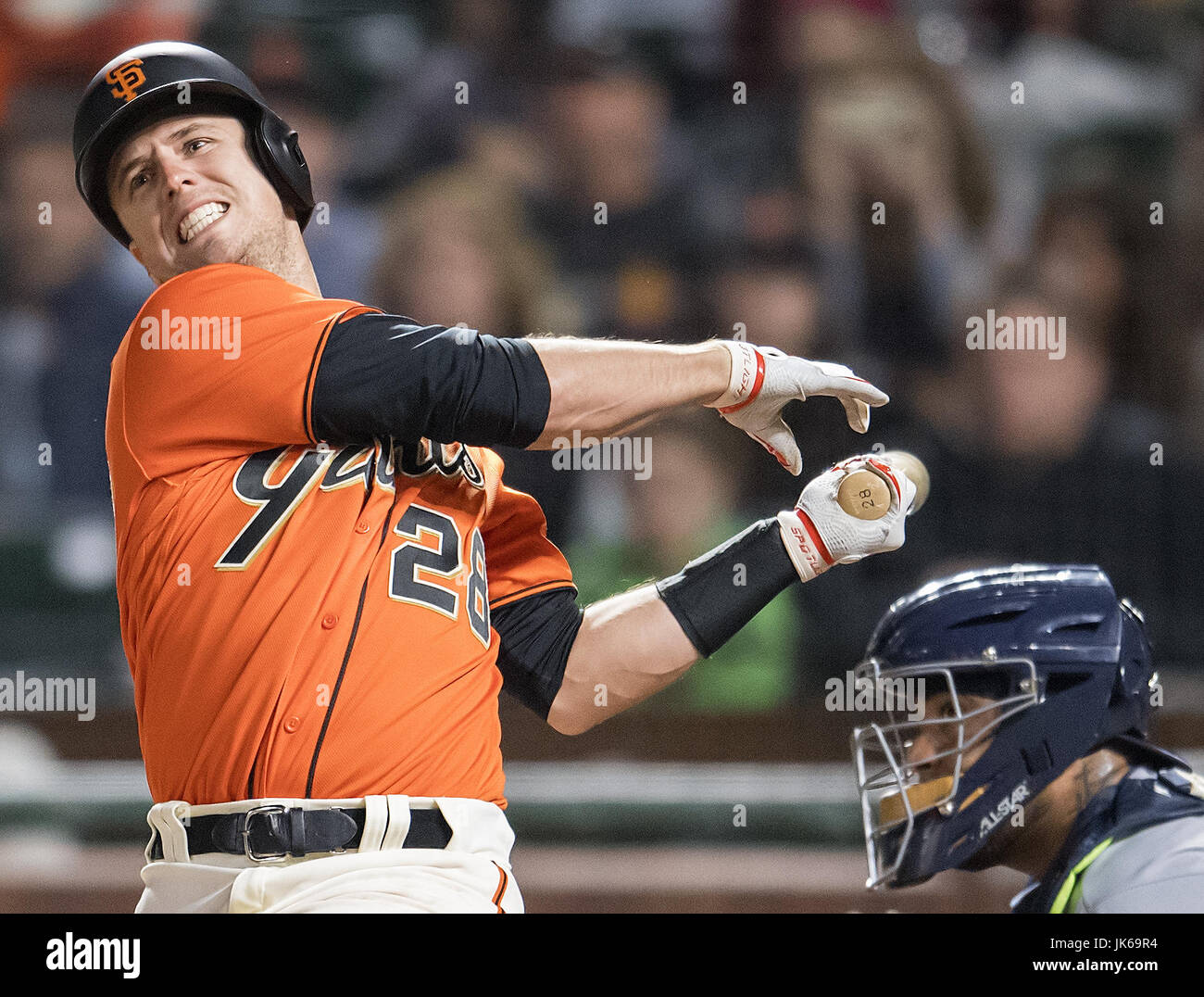 San Francisco, California, USA. 21st July, 2017. San Francisco Giants catcher Buster Posey (28) watches his ball go foul in the seventh inning, during a MLB game between the San Diego Padres and the San Francisco Giants at AT&T Park in San Francisco, California. Valerie Shoaps/CSM/Alamy Live News Stock Photo