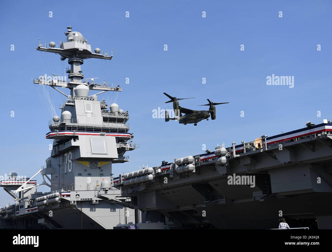 Norfolk, USA. 22nd July, 2017. A U.S. Marines MV-22B Osprey lands on USS Gerald R. Ford for its commissioning ceremony at Naval Station Norfolk, Virginia, the United States, on July 22, 2017. The U.S. Navy commissioned United States Ship (USS) Gerald R. Ford, the newest and most advanced aircraft carrier, at Naval Station Norfolk, a navy base in Virginia on Saturday. Credit: Yin Bogu/Xinhua/Alamy Live News Stock Photo