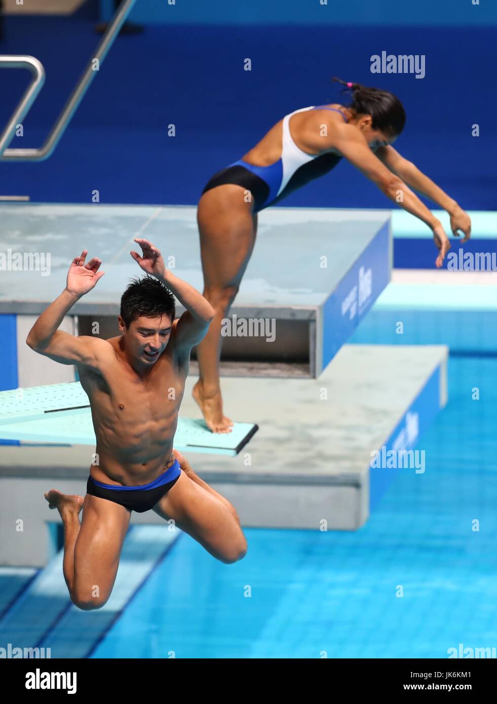 (170723) -- July 23,  2017 (Xinhua) -- Julian Sanchez (L) of Mexico falls from his board accidentally during the Mixed 3m Springboard Synchro final of Diving at the 17th FINA World Championships at Duna Arena in Budapest, Hungary on July 22, 2017. Arantxa Chavez Munoz and Julian Sanchez of Mexico placed 13th with 223.80 points. (Xinhua/Gong Bing) Stock Photo