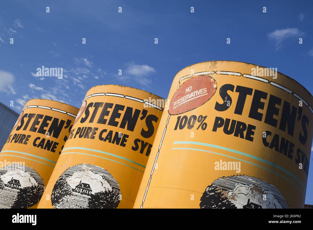 Oversized cans of pure sugar cane syrup hires stock photography and