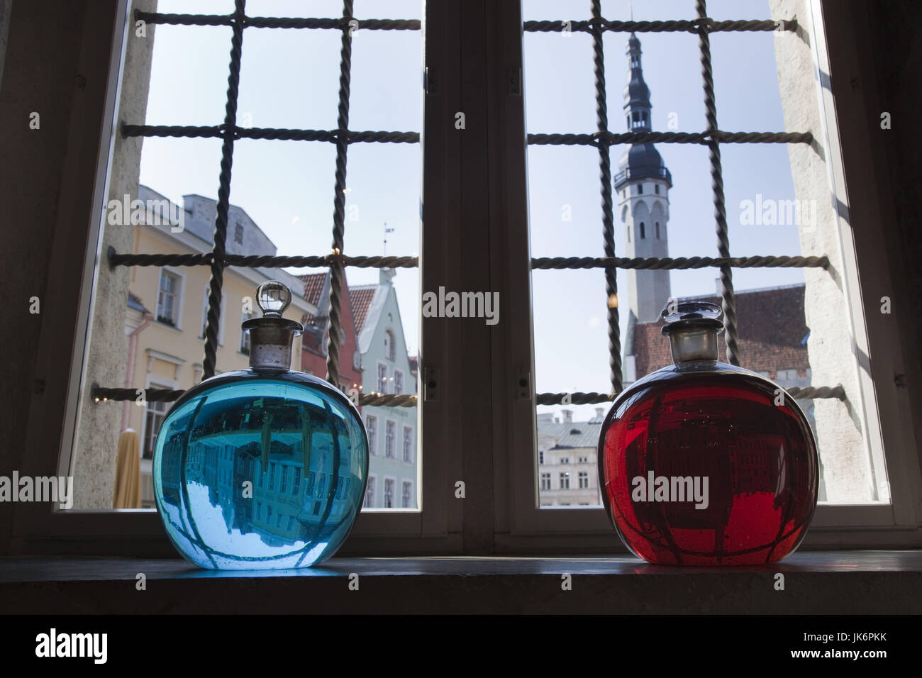 Estonia, Tallinn, Old Town, Raekoja Plats, Town Hall Square, Town Council Pharmacy, b. 1422, colored liquid in window overlooking town hall Stock Photo