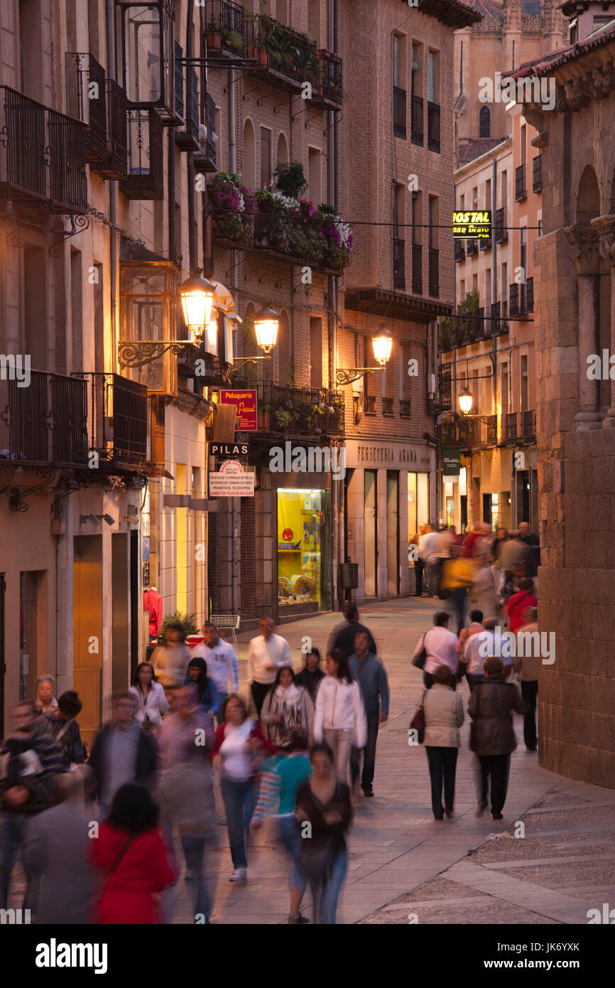 Spain, Castilla y Leon Region, Segovia Province, Segovia, pedestrians on Calle Juan Bravo street, dusk Stock Photo
