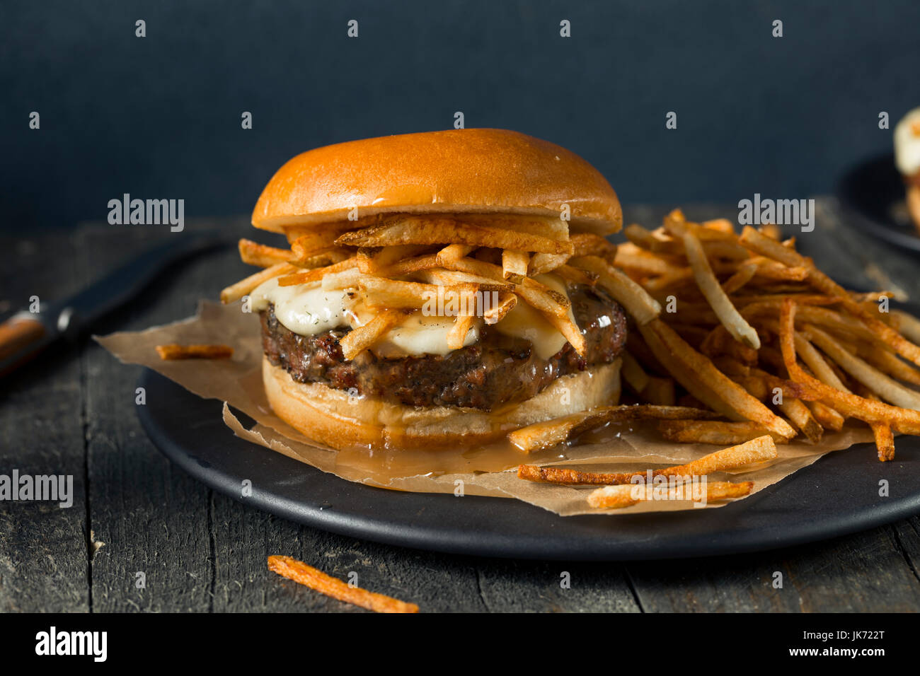 Homemade Poutine Hamburger with Fries Gravy and Cheese Curds Stock