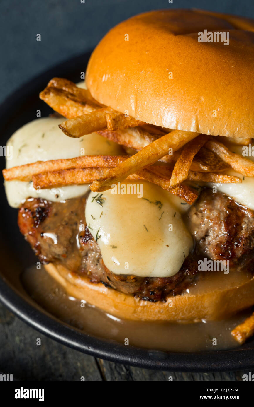 Homemade Poutine Hamburger with Fries Gravy and Cheese Curds Stock